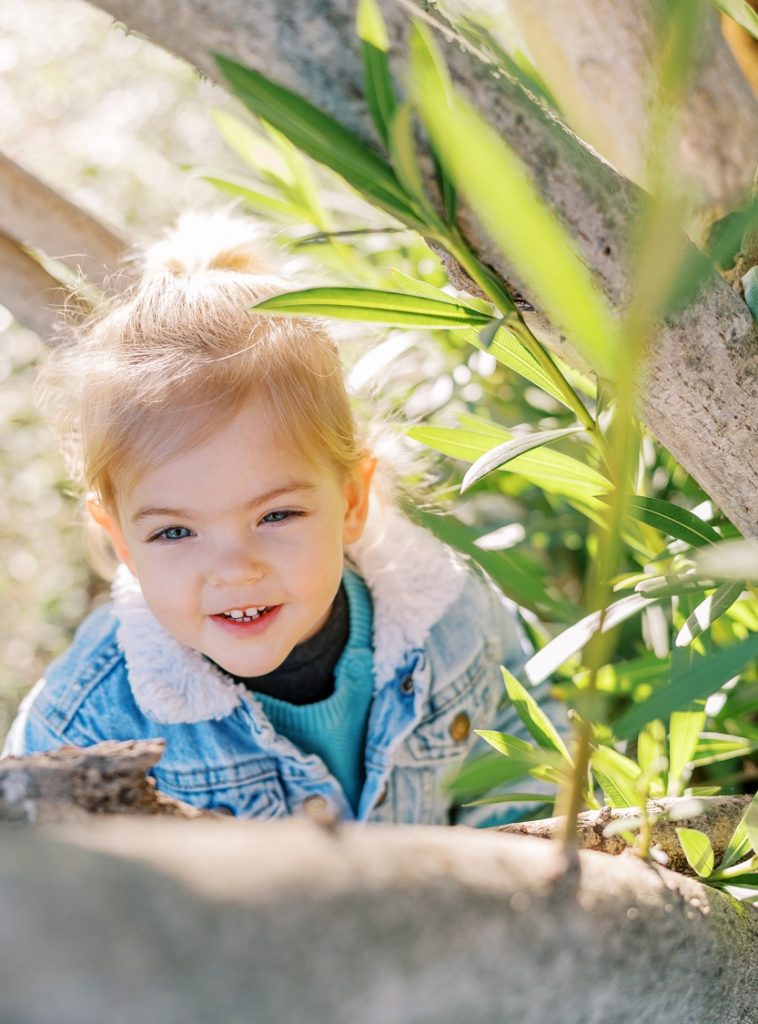 little girl in blue windmill day nursery garden in rugby