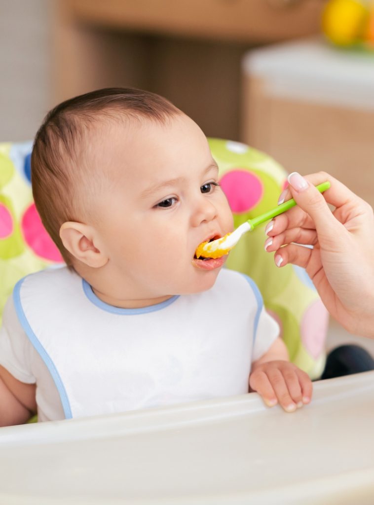 baby being fed at blue windmill day nursery in rugby