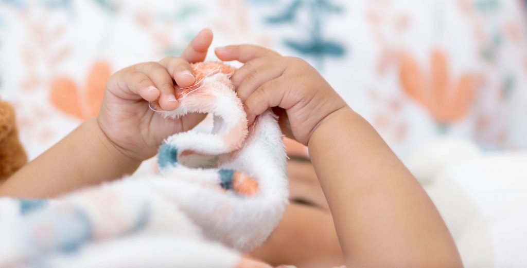 Baby in a cot at nursery