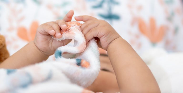 Baby in a cot at nursery