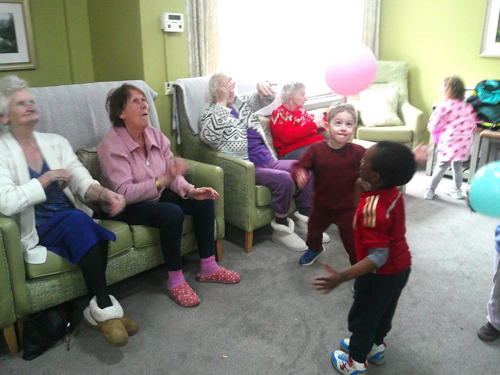 Blue Windmill nursery visit to care home in Rugby having intergenerational fun