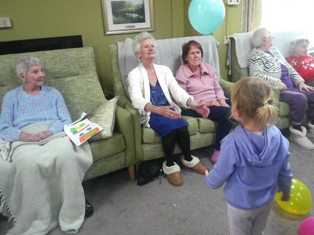 Blue Windmill nursery visit to care home to share a game of balloons