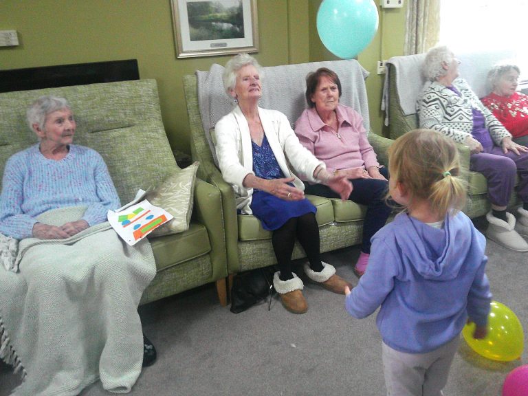 Blue Windmill nursery visit to care home to share a game of balloons